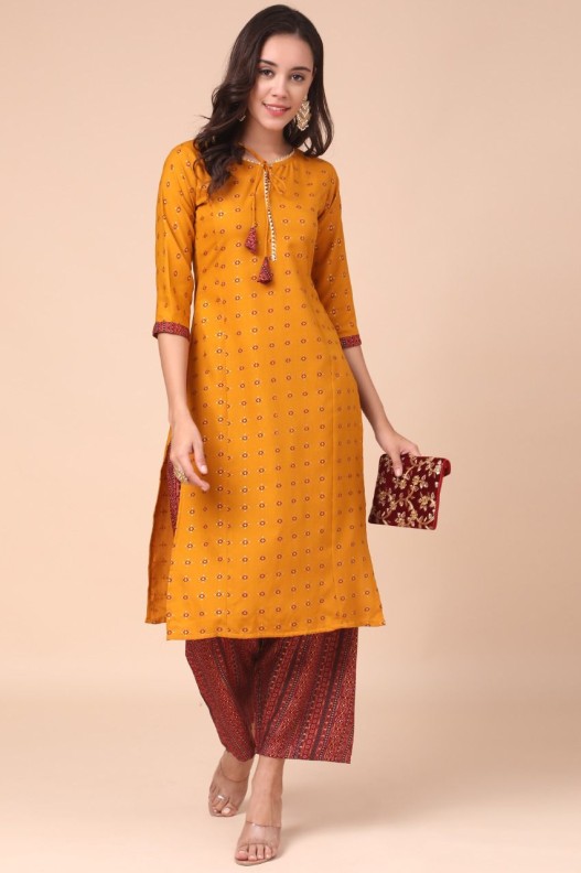 Stylish Mustard Cotton Blend Kurti With Multicolour Plazzo